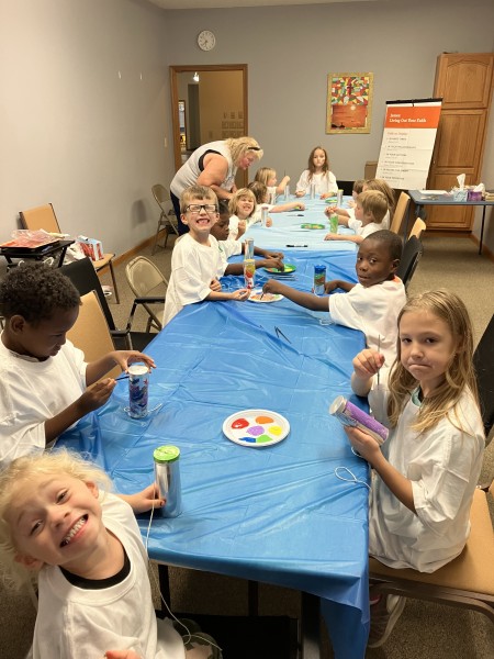 Children at a table working on crafts