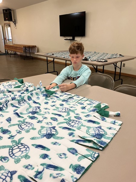 A boy working with fabric