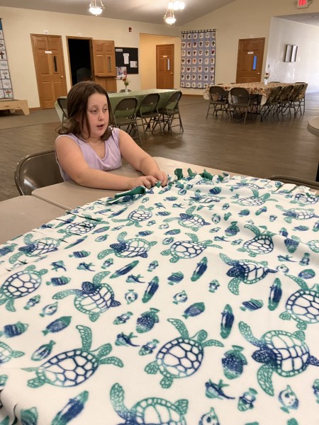 A girl working with fabric