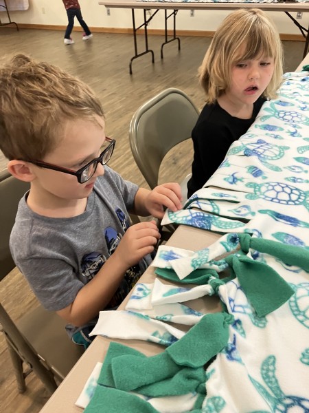 A boy working with fabric